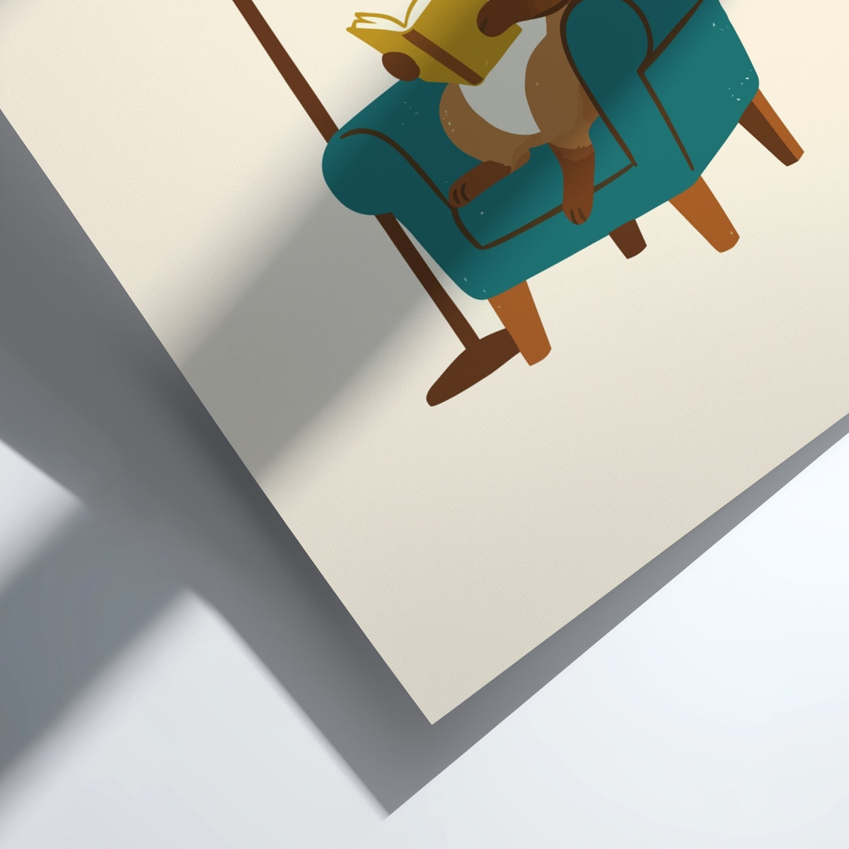 Poster of a brown tabby cat with glasses reading a book in a chair