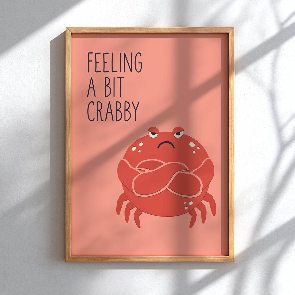 Poster featuring a grumpy red crab with crossed arms and the text Feeling a Bit Crabby.