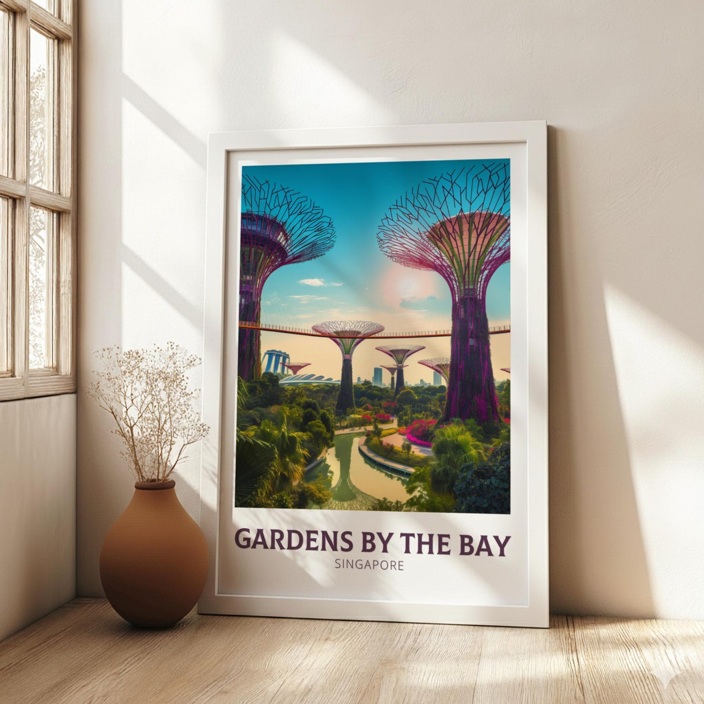 Framed poster of Gardens by the Bay in Singapore on a wall with a vase on a wooden floor.