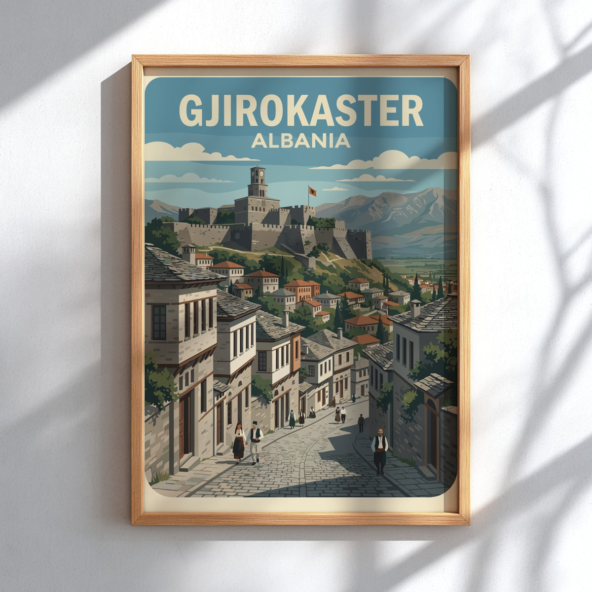 Poster of Gjirokaster Albania featuring a historic stone castle overlooking traditional houses and mountains.
