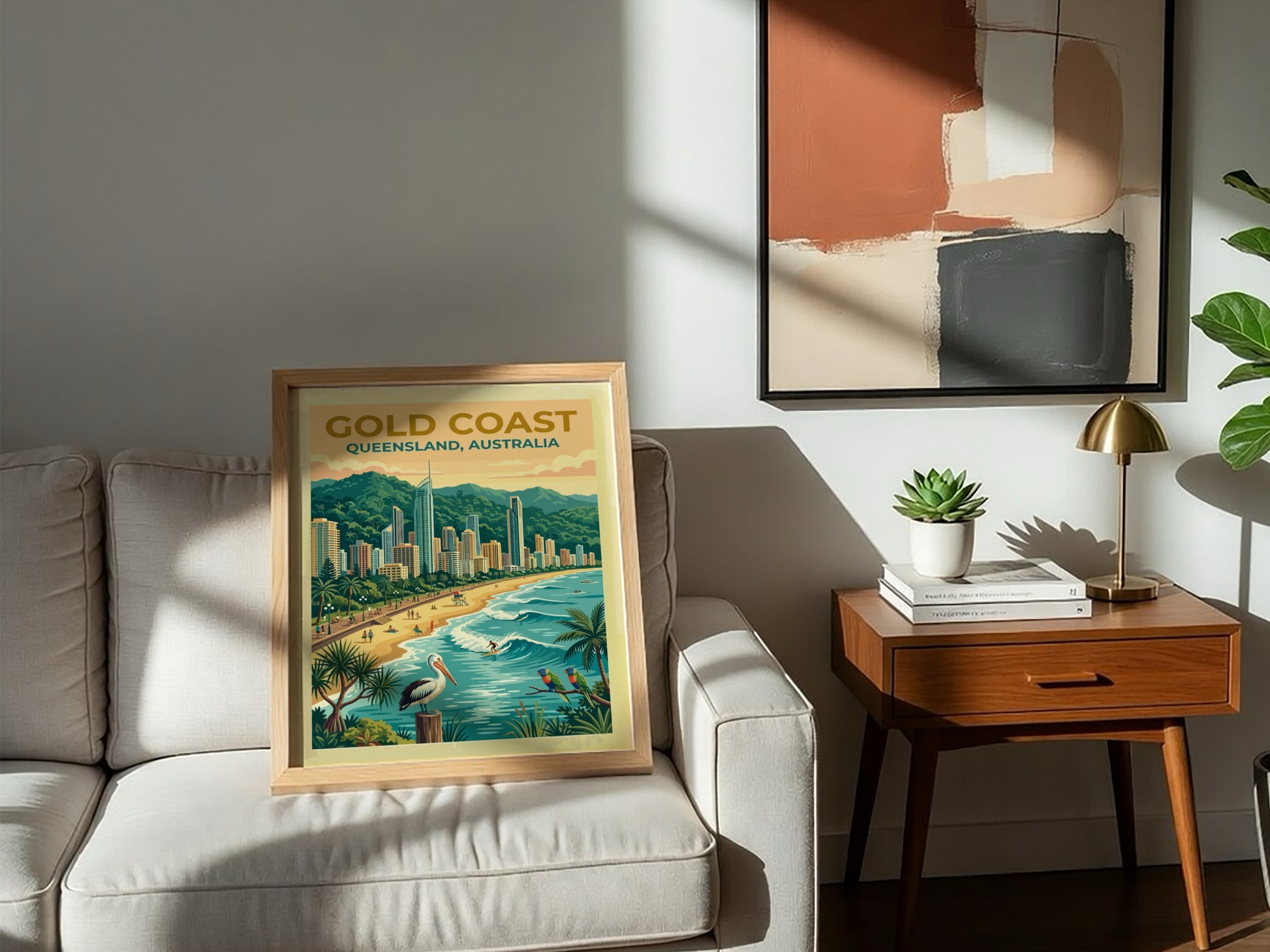 Travel poster of Gold Coast Queensland featuring high-rise buildings, sandy beach, pelican and parrots.