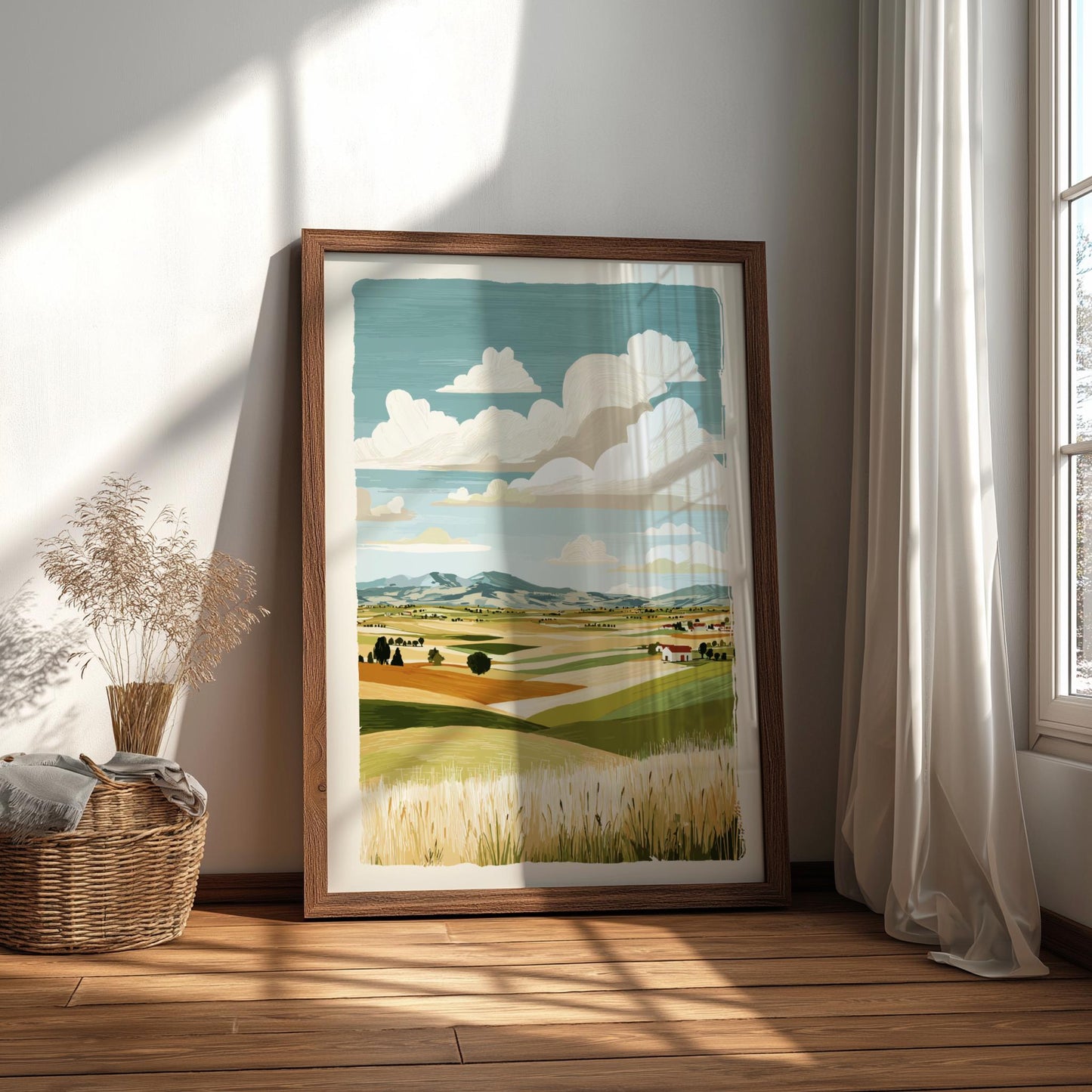 Framed landscape print on a wall in a bright room with sunlight streaming through a window.