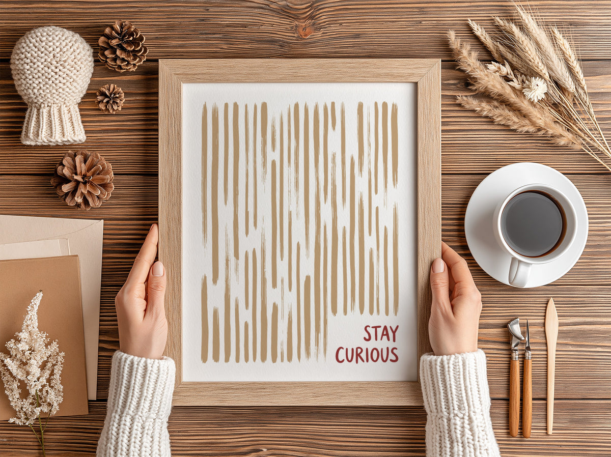 Motivational poster featuring vertical tan brushstrokes and the words Stay Curious in red.