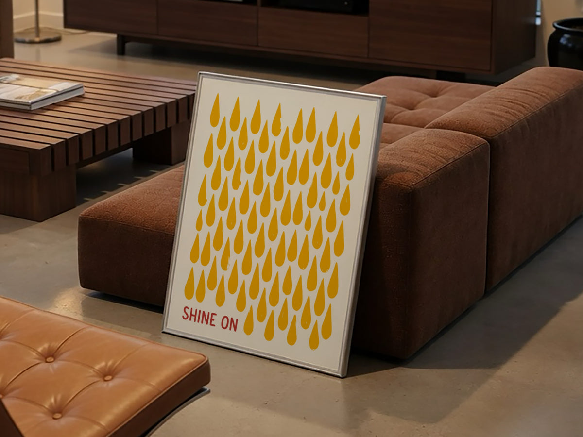 Motivational poster with yellow raindrop patterns on cream background and Shine On text