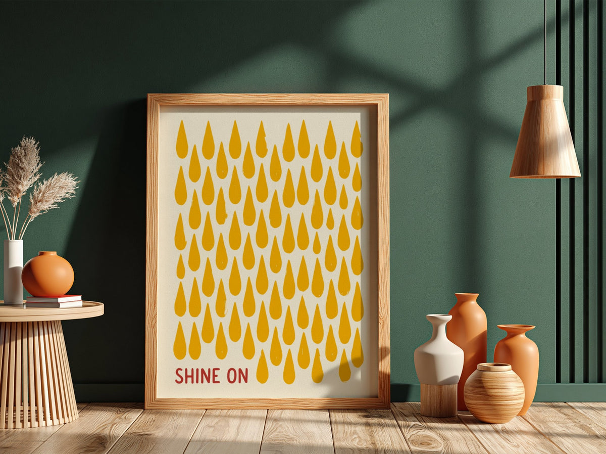 Motivational poster with yellow raindrop patterns on cream background and Shine On text