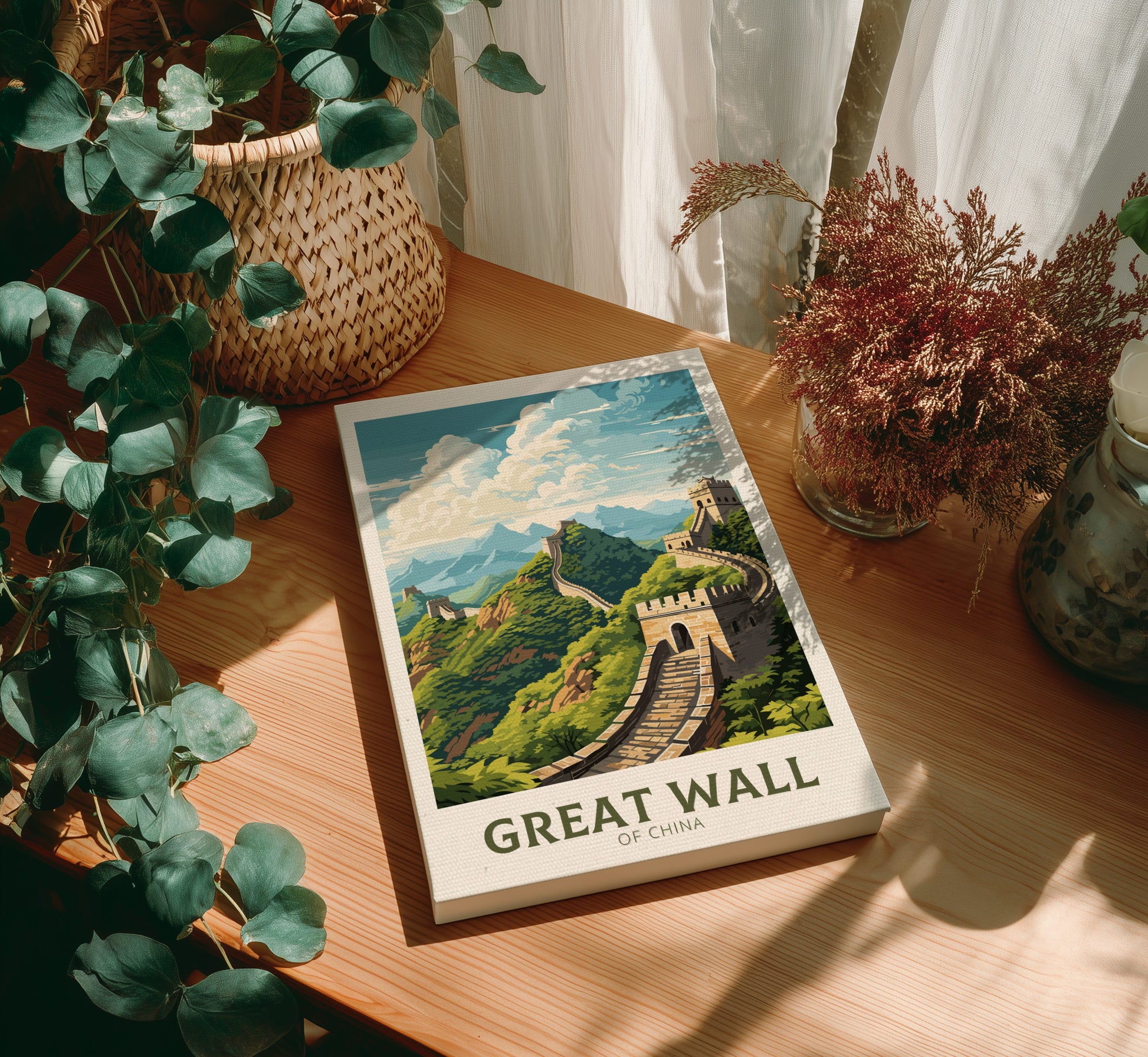 Canvas of 'Great Wall of China' on a wooden table with plants around
