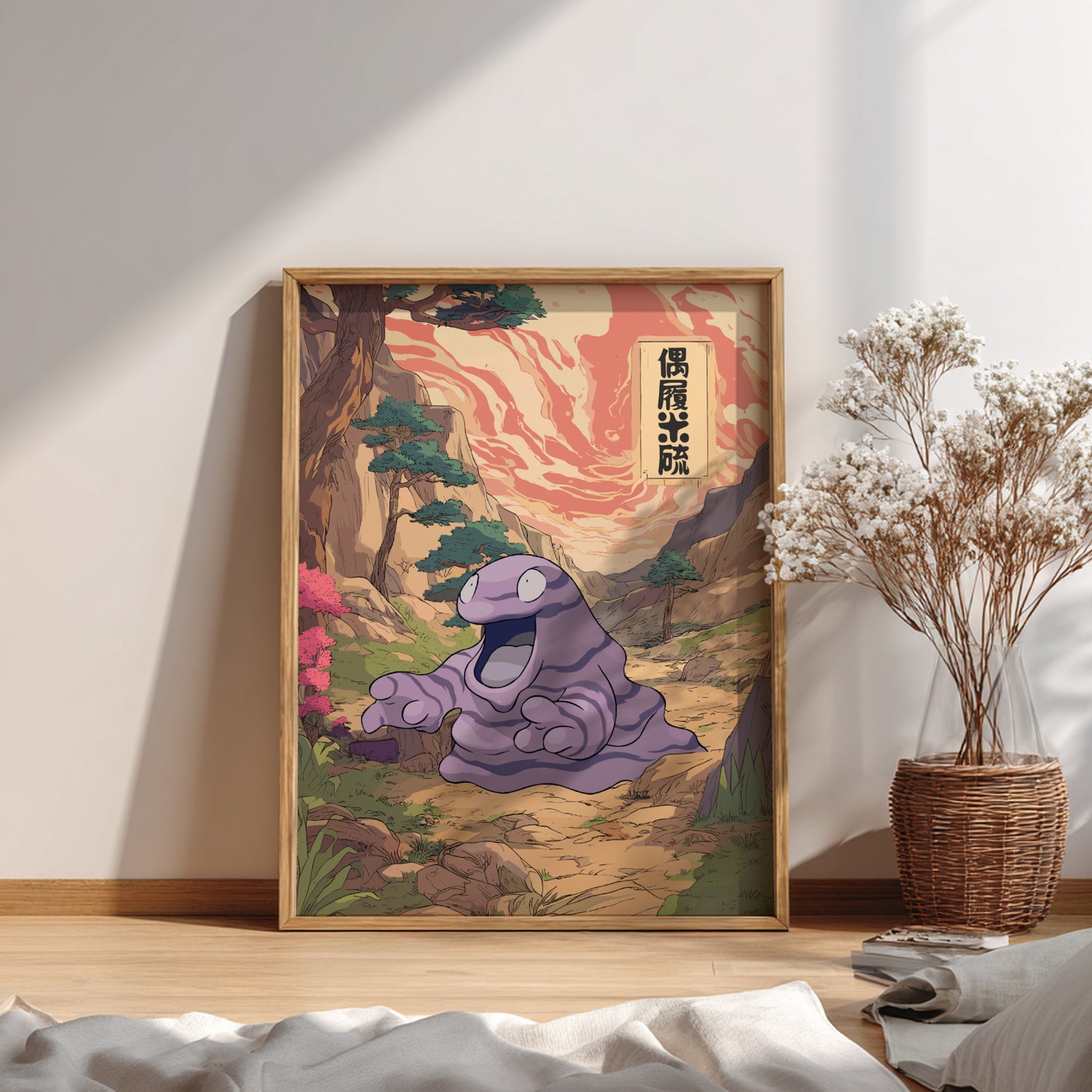 Framed artwork of Grimer Pokemon in a natural setting on a wall.