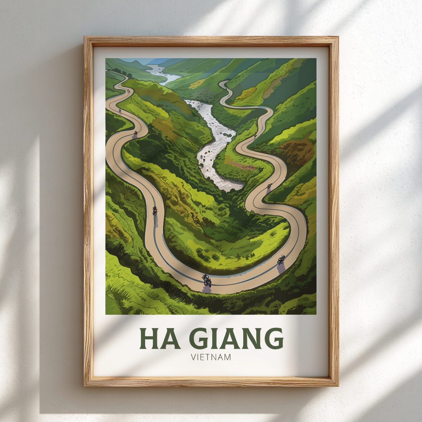 Framed artwork of a winding road through green hills with 'Ha Giang Vietnam' text.