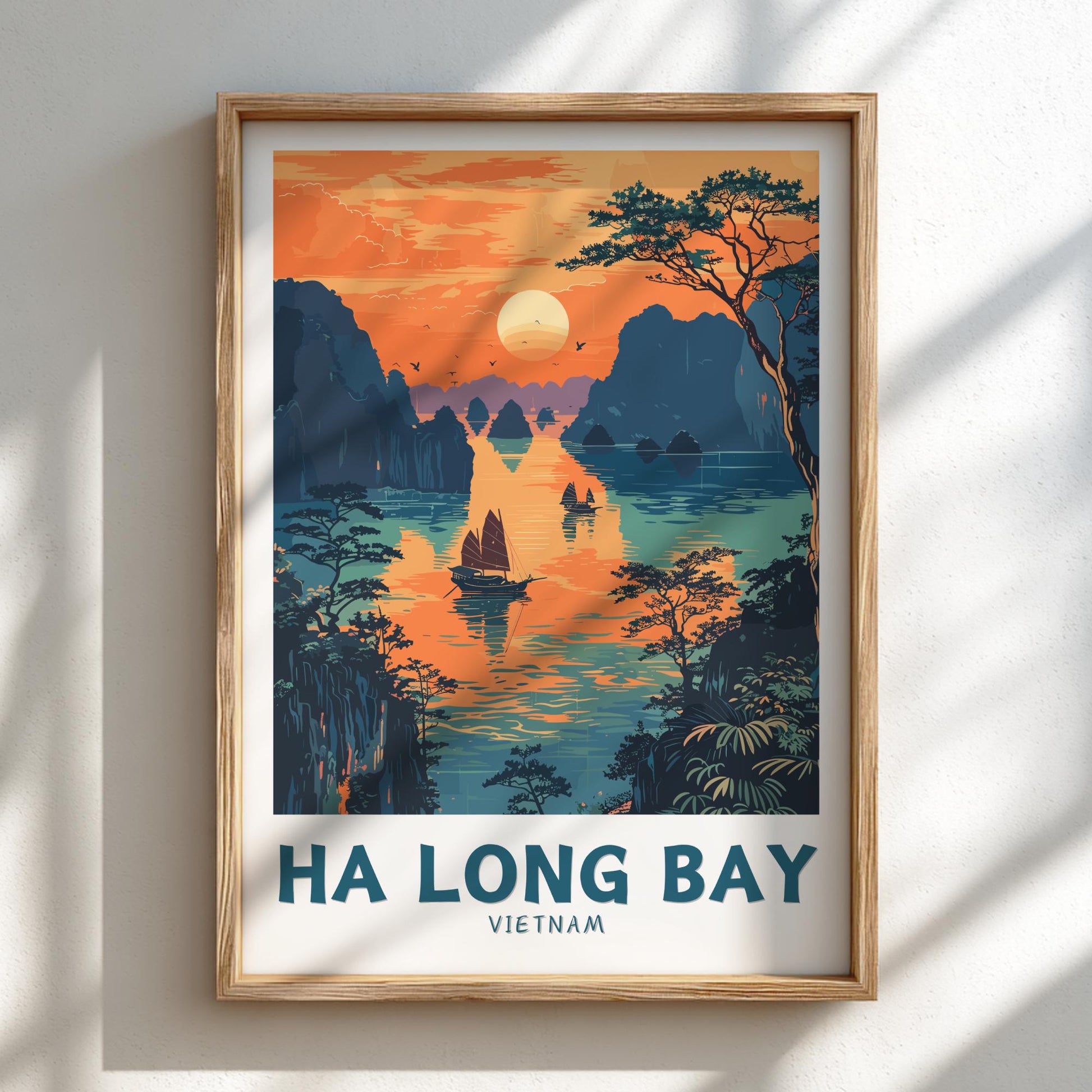 Framed artwork of Ha Long Bay, Vietnam with a sunset over water and mountains.