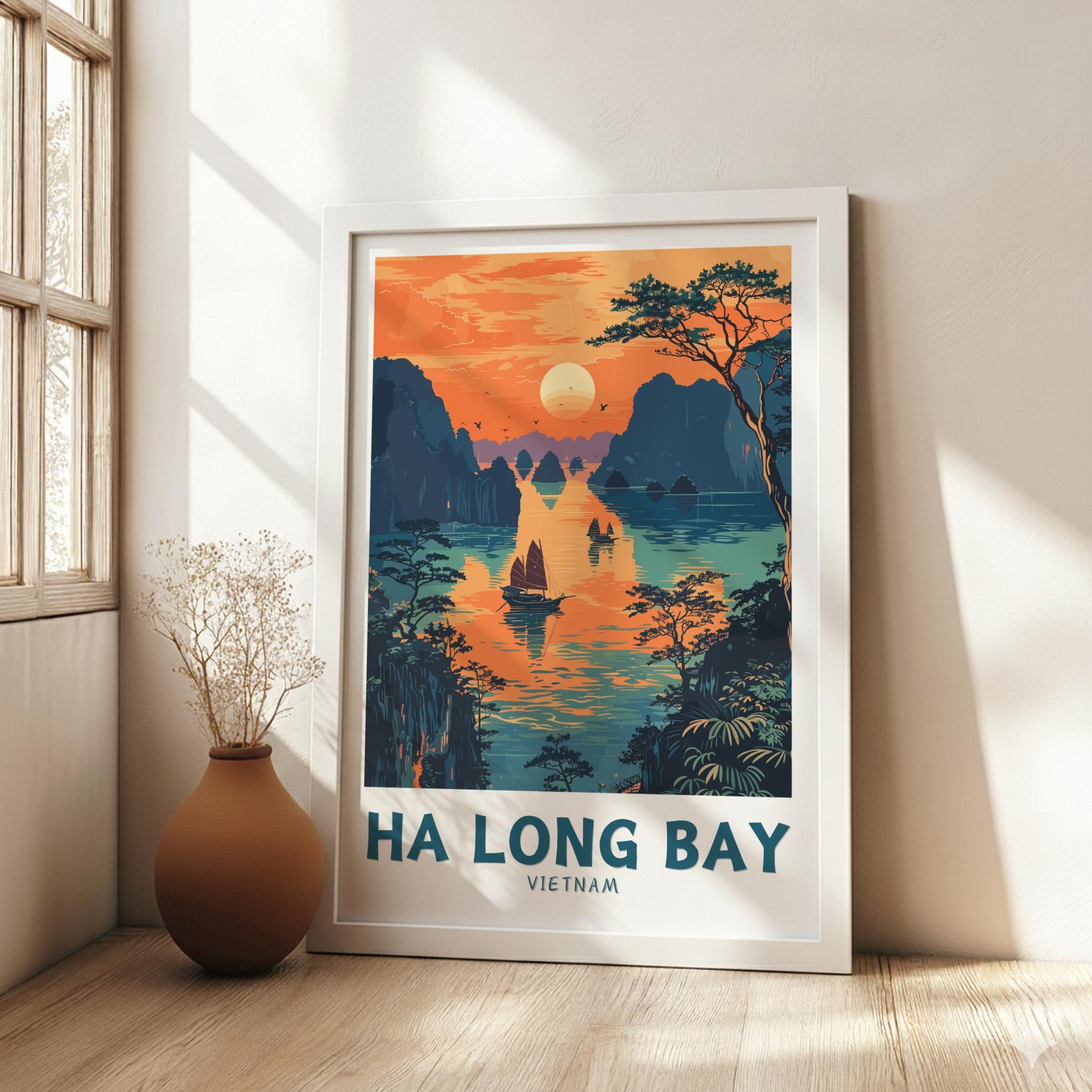 Framed poster of Ha Long Bay, Vietnam in a room with a vase on a wooden floor.