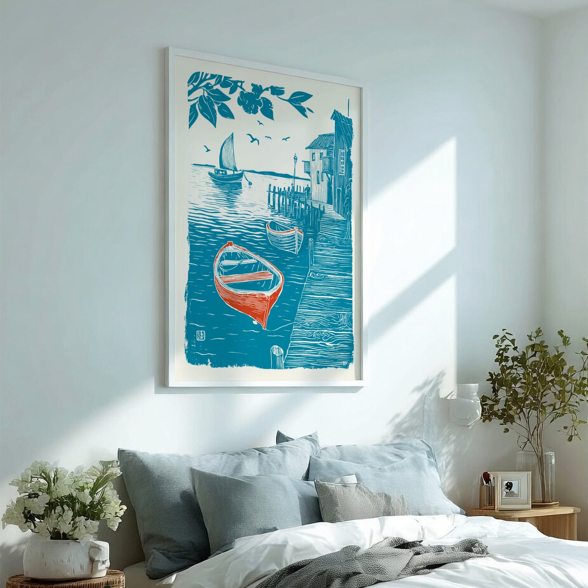 Framed artwork of a boat on a dock in a bedroom with a bed and decor.