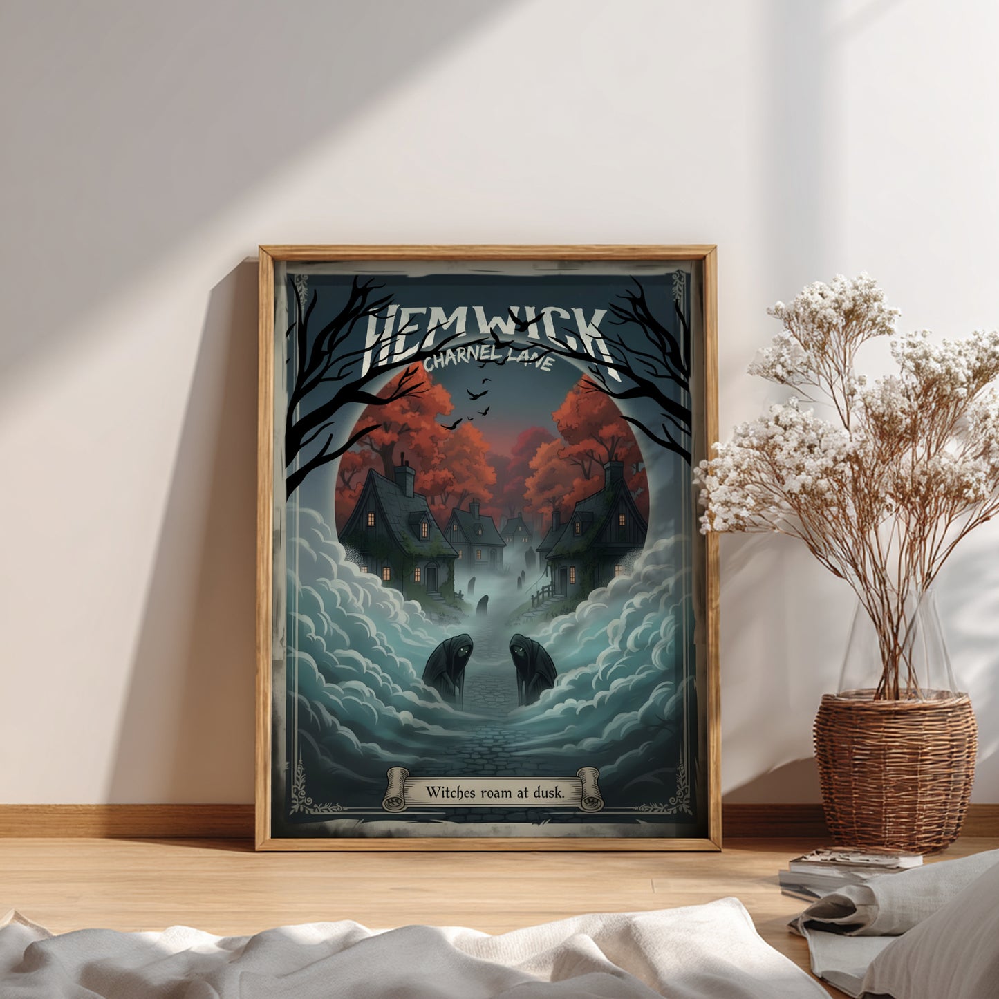 Framed artwork of Hemwick Charnel Lane from Bloodborne on a wall with a plant and decor items below.