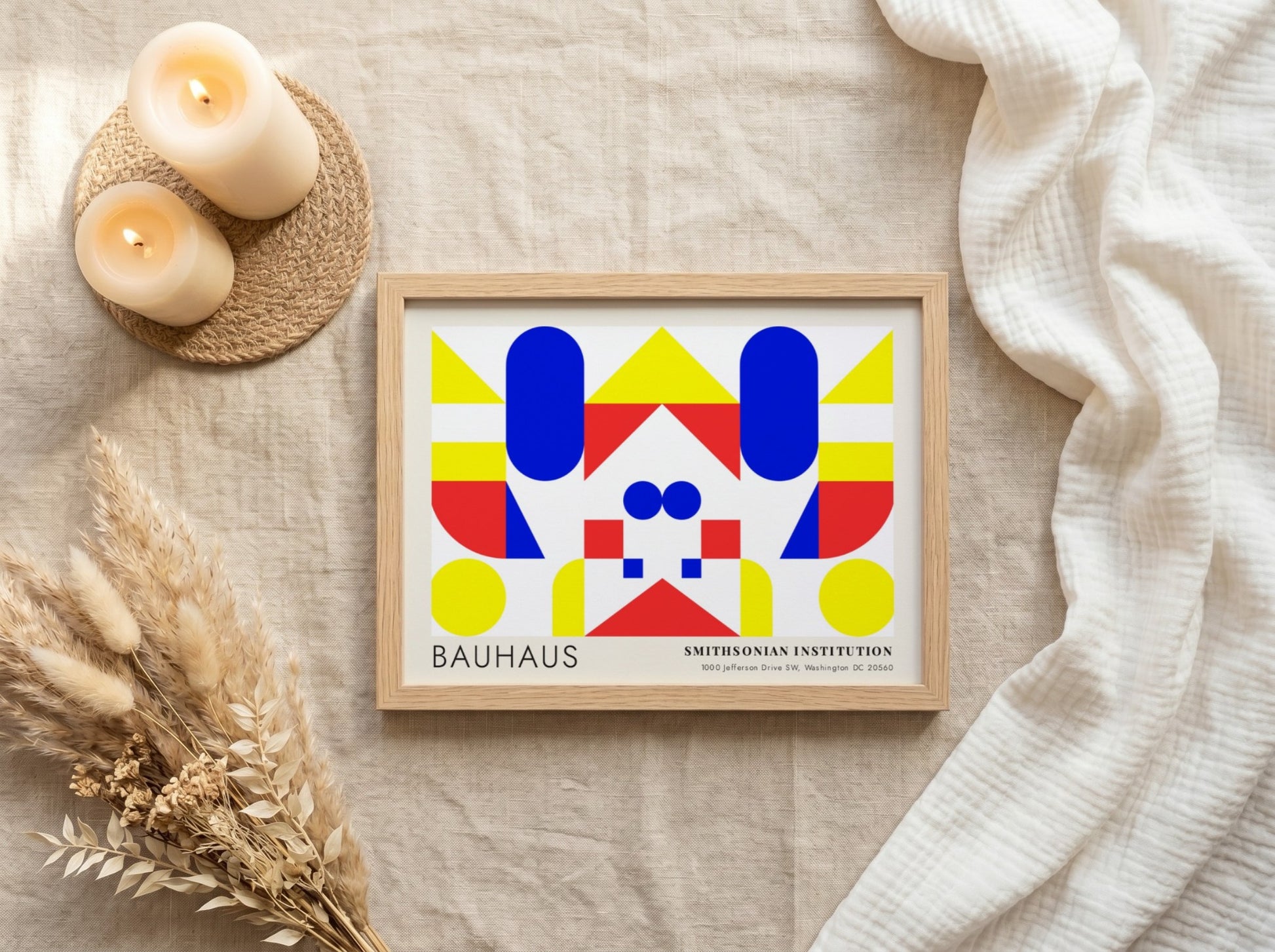 Bauhaus exhibition poster featuring geometric shapes in yellow red and blue by Herbert Bayer