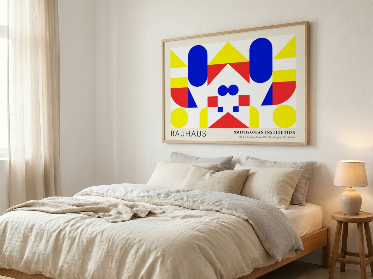 Bauhaus exhibition poster featuring geometric shapes in yellow red and blue by Herbert Bayer