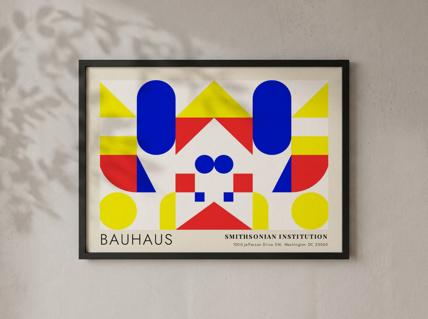 Bauhaus exhibition poster featuring geometric shapes in yellow red and blue by Herbert Bayer