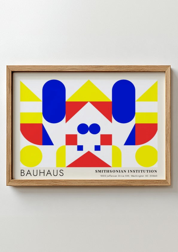 Bauhaus exhibition poster featuring geometric shapes in yellow red and blue by Herbert Bayer