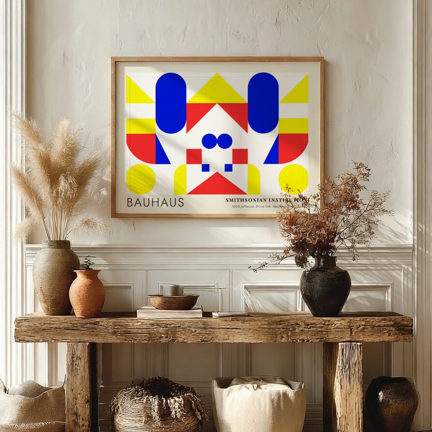 Bauhaus exhibition poster featuring geometric shapes in yellow red and blue by Herbert Bayer