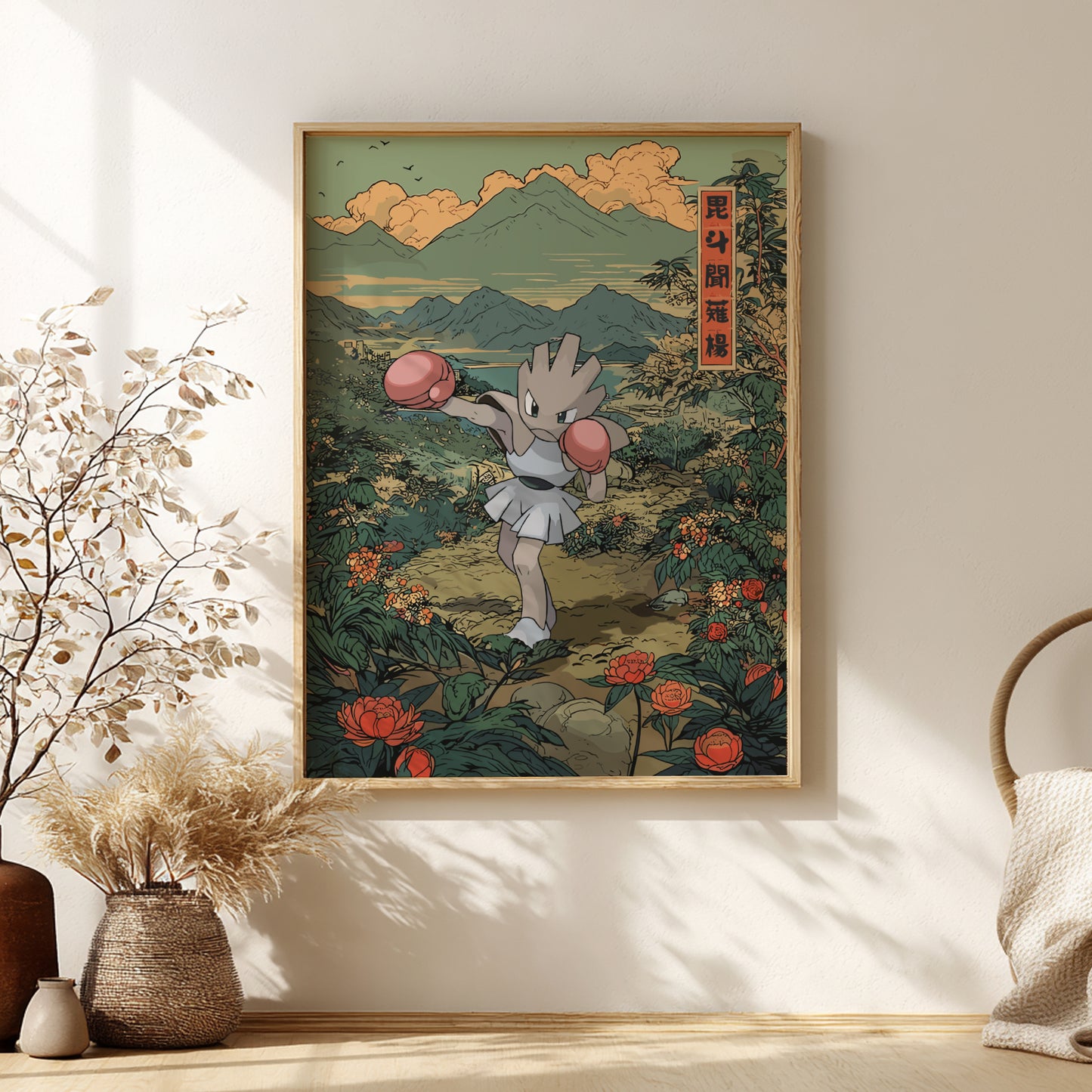 Framed artwork of Hitmonchan Pokemon character in a scenic setting with mountains and flowers, displayed on a wall.
