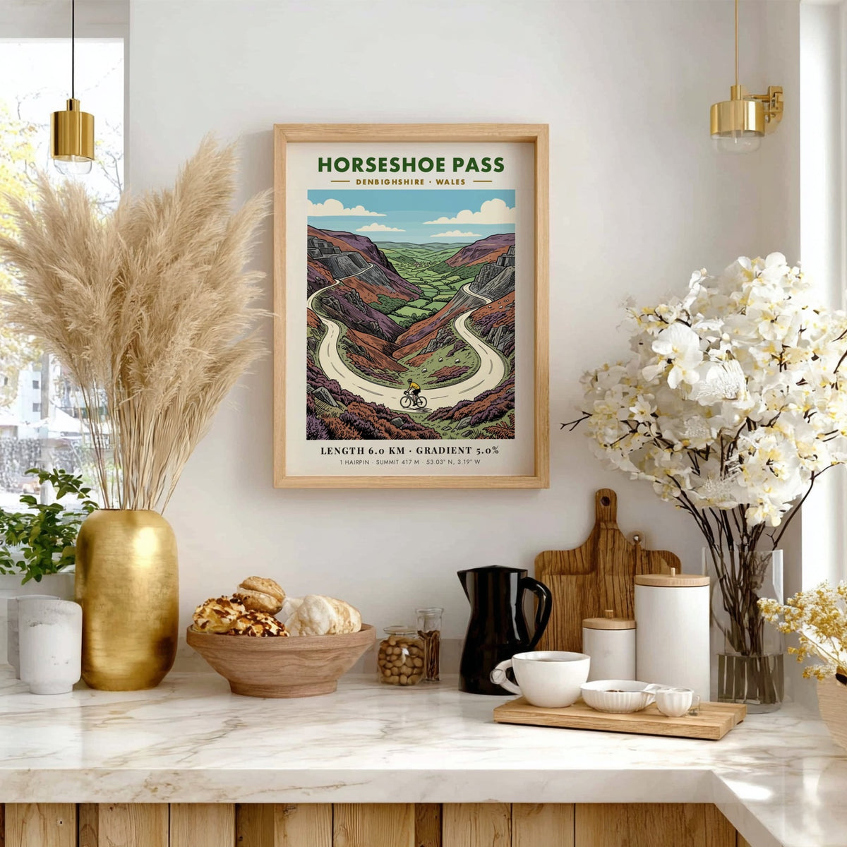 Poster of Horseshoe Pass in Denbighshire featuring a cyclist on a winding road