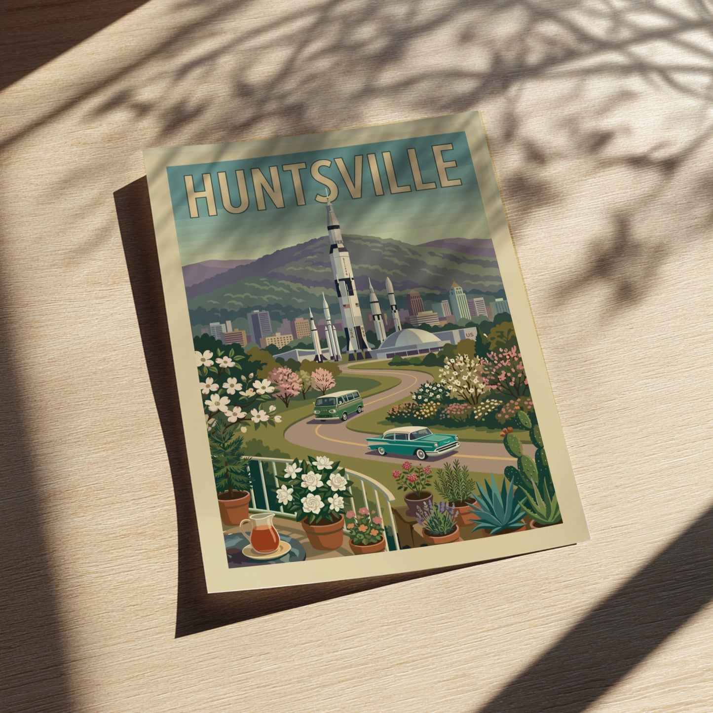 Huntsville Rocket City poster featuring a Saturn V rocket, vintage cars, and retro cityscape in a warm,