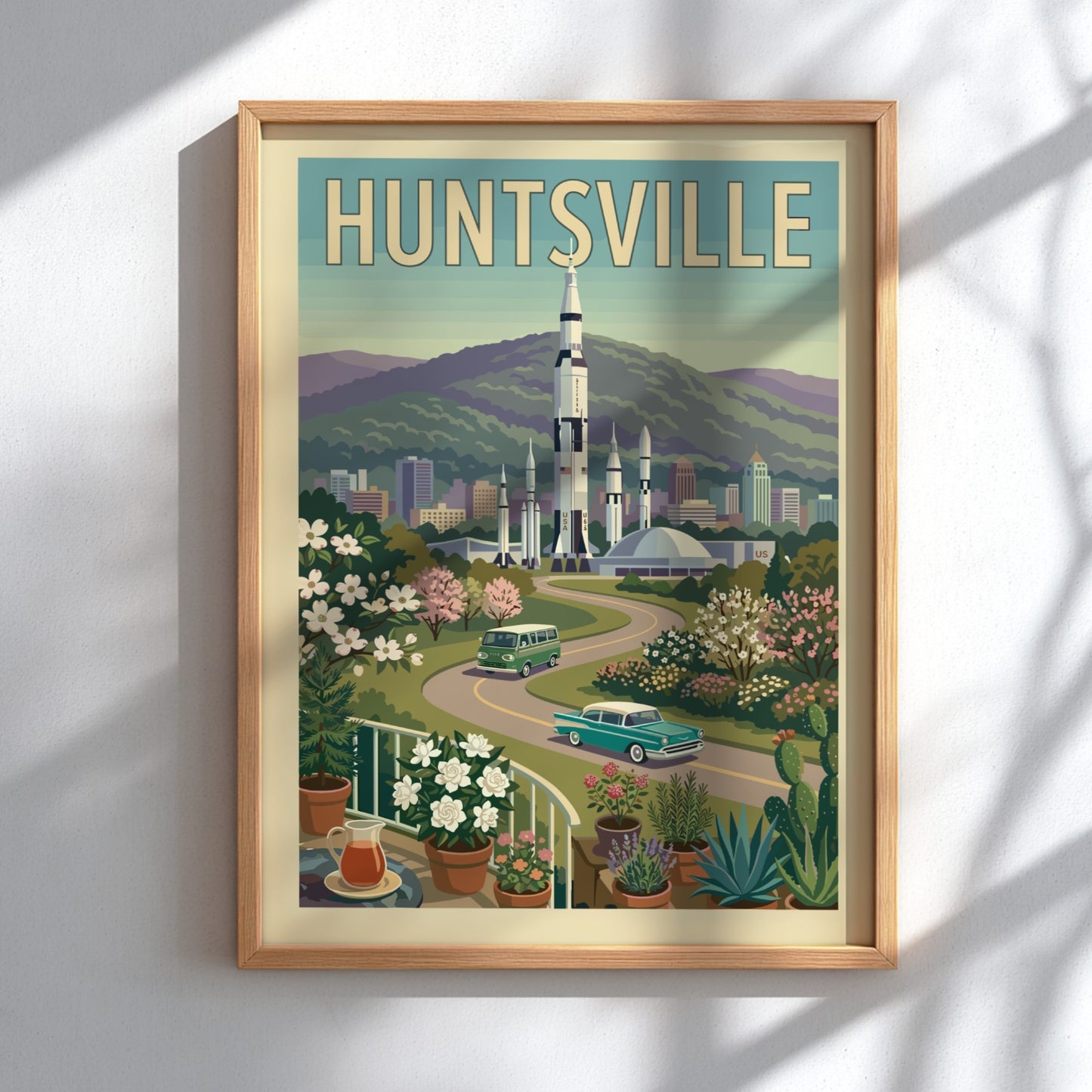 Huntsville Rocket City poster featuring a Saturn V rocket, vintage cars, and retro cityscape in a warm,
