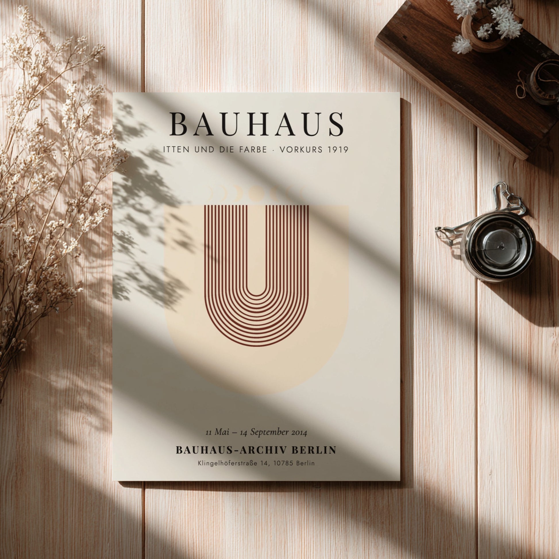 Bauhaus poster featuring geometric shapes and warm colors, inspired by Itten's color theory.