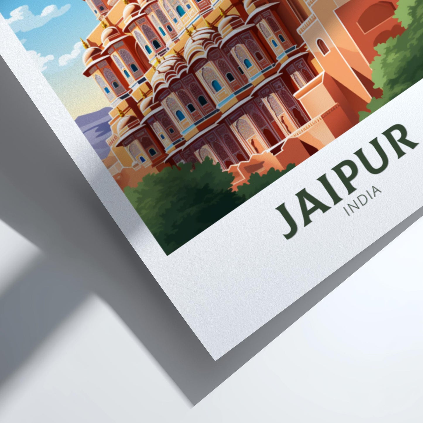 Framed artwork of a colorful building with 'Jaipur, India' text on a white background