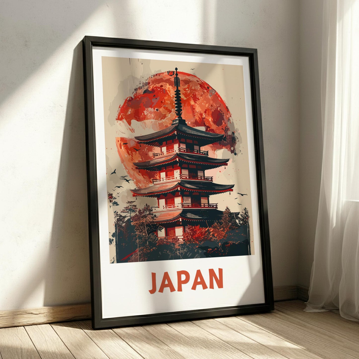 Framed poster of a Japanese temple with a red moon in a room with sunlight filtering through curtains.