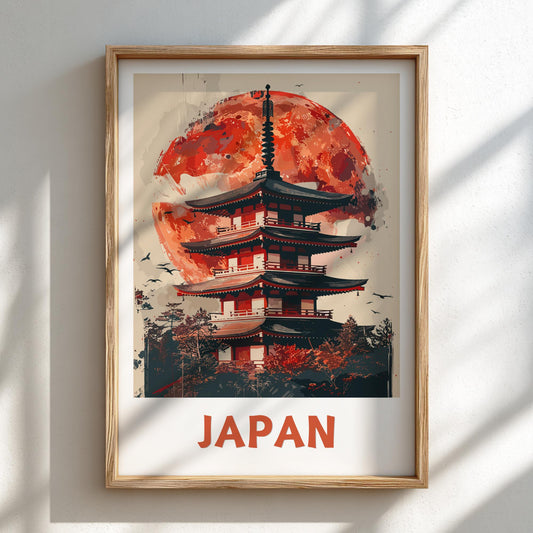 Framed artwork of a Japanese temple with a red moon on a white wall.