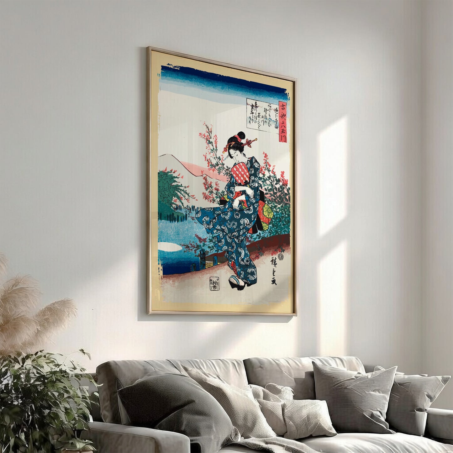 Vintage Japanese woodblock print poster of a woman in a blue kimono holding a fan, surrounded by cherry