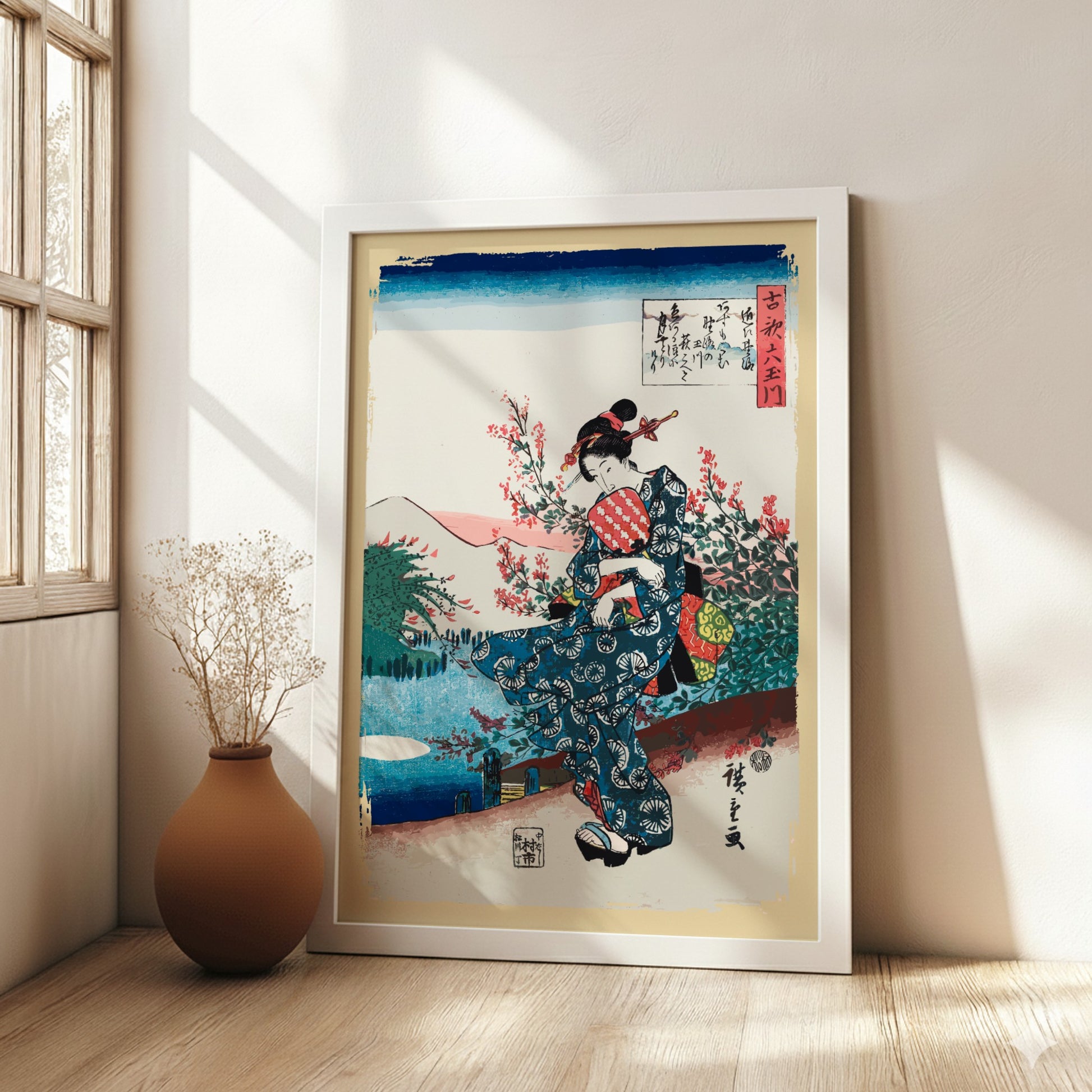 Vintage Japanese woodblock print poster of a woman in a blue kimono holding a fan, surrounded by cherry