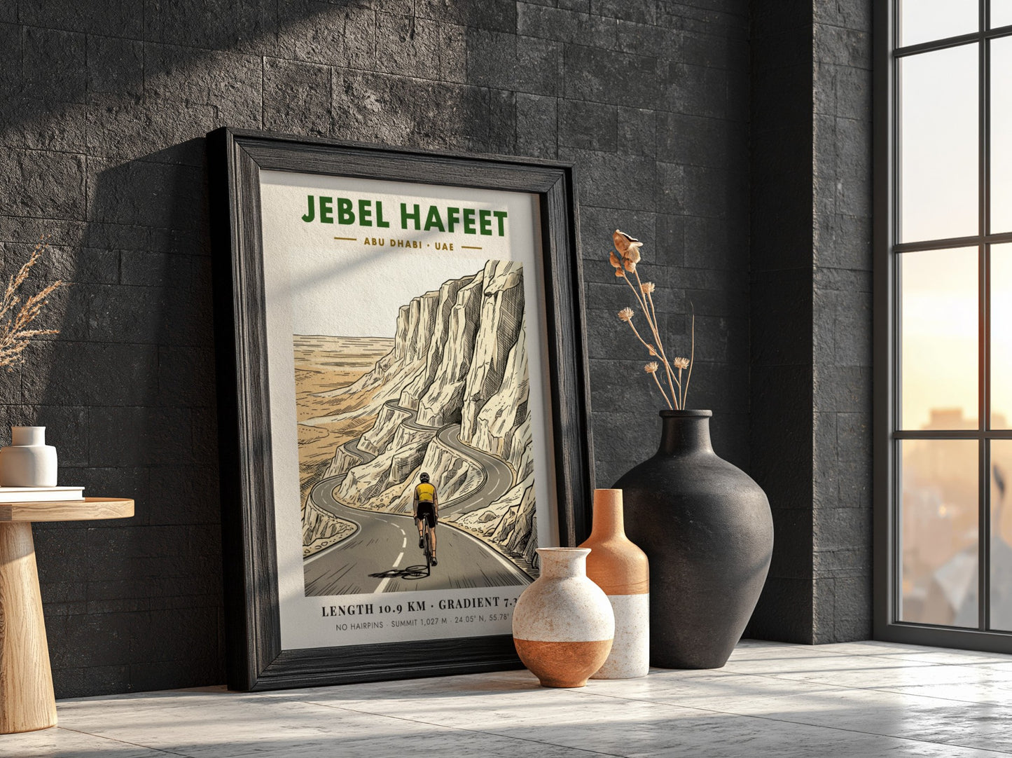 Poster of a cyclist riding up the winding Jebel Hafeet mountain road in Abu Dhabi