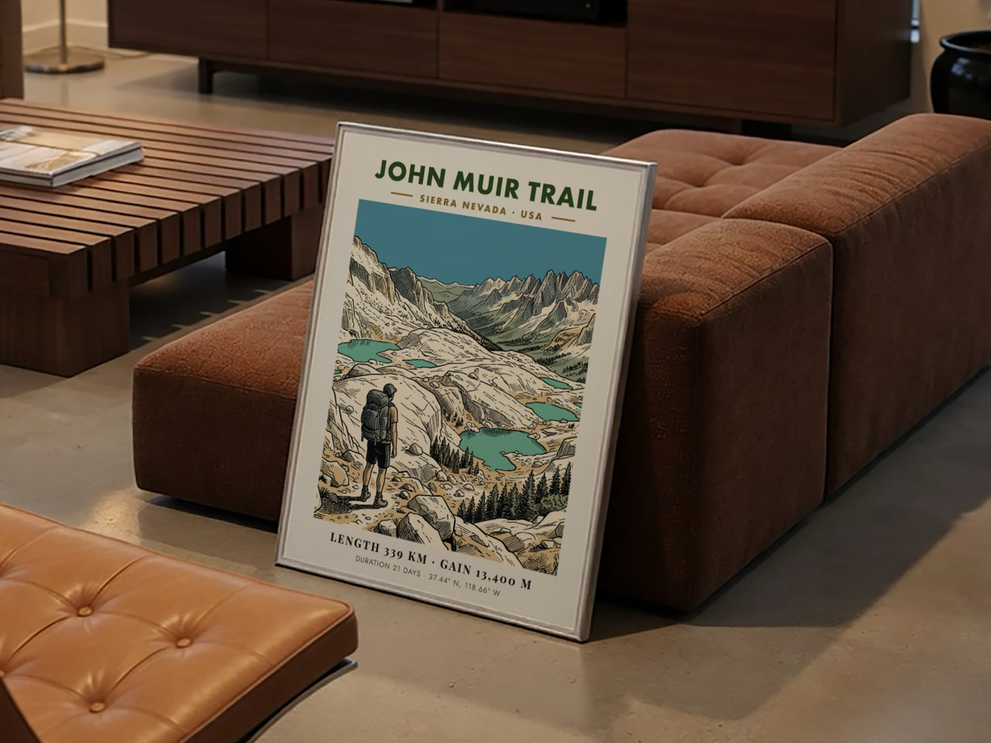 Poster of the John Muir Trail showing a hiker looking at alpine lakes.