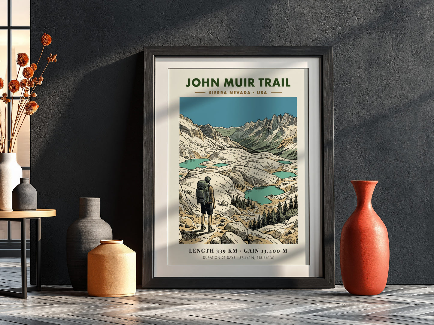 Poster of the John Muir Trail showing a hiker looking at alpine lakes.