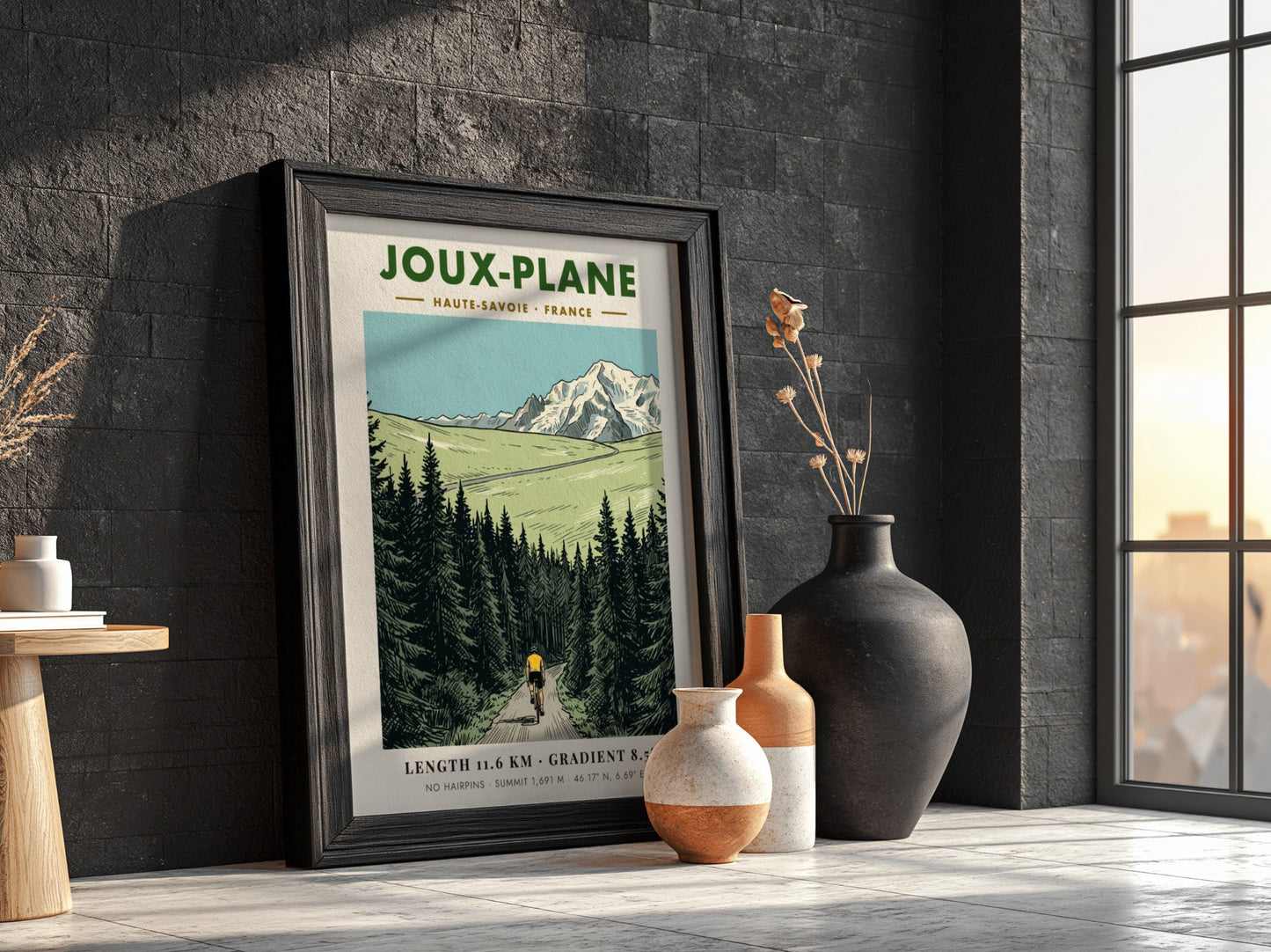 Poster of a cyclist climbing the winding road toward the snowy Joux-Plane mountain.