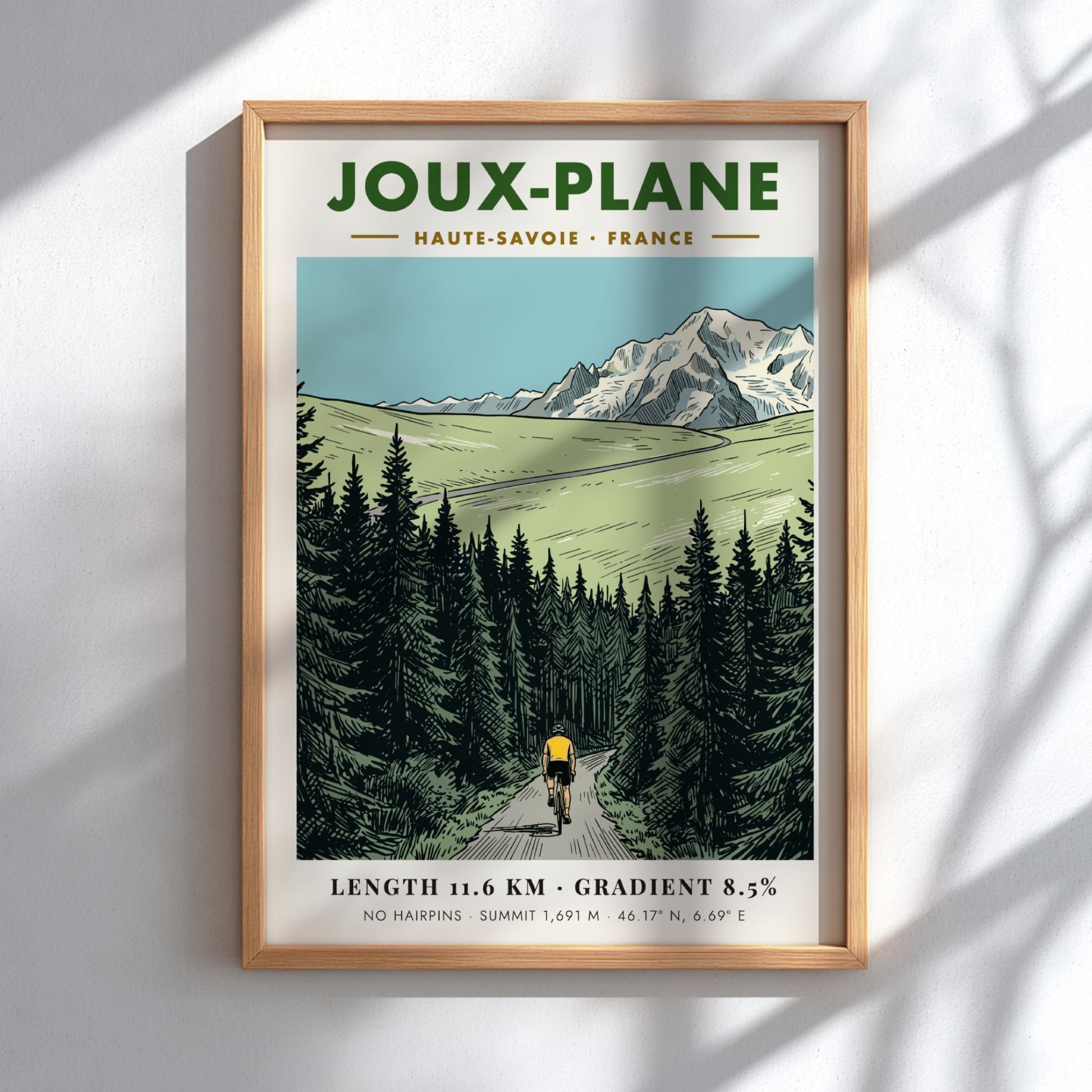 Poster of a cyclist climbing the winding road toward the snowy Joux-Plane mountain.