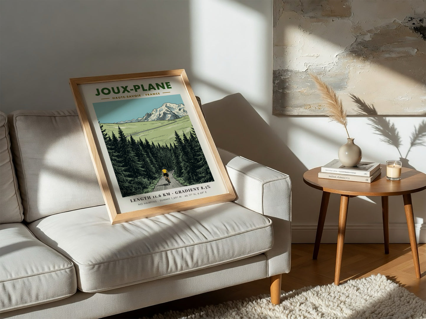 Poster of a cyclist climbing the winding road toward the snowy Joux-Plane mountain.