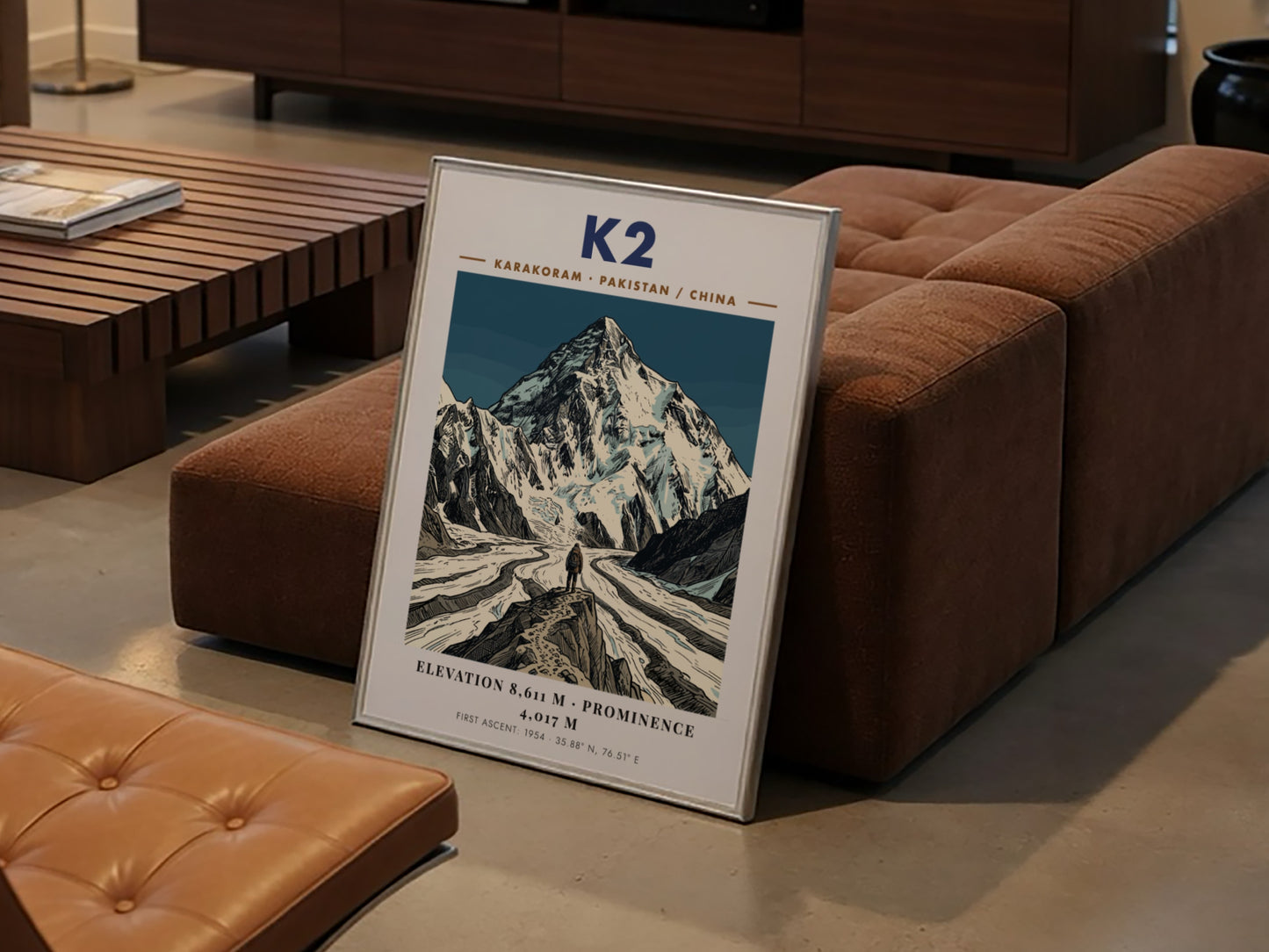 Poster featuring K2 mountain with deep blue tones and a climber in front.