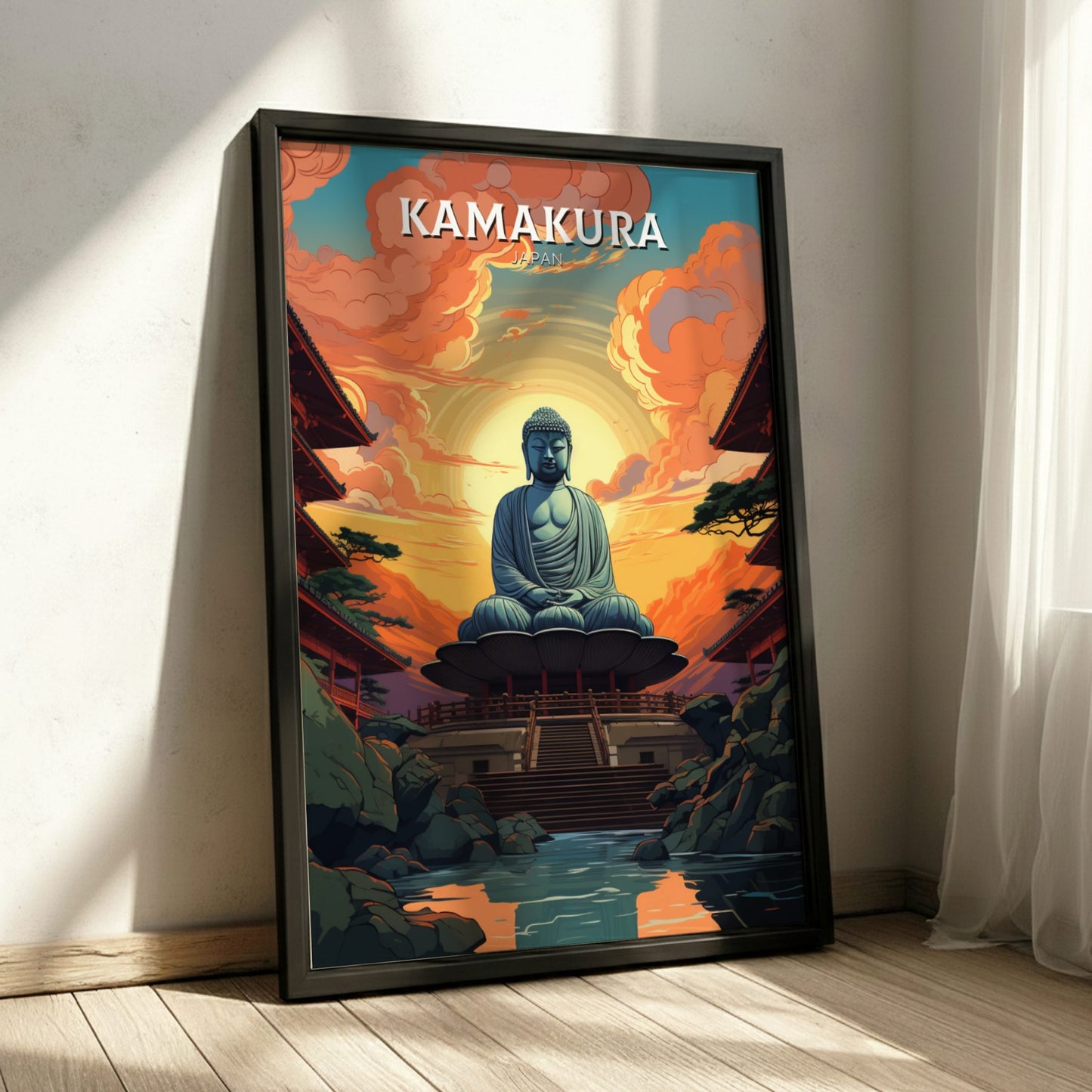 Framed poster of a Buddha statue with 'Kamakura' text in a room with sunlight filtering through curtains.