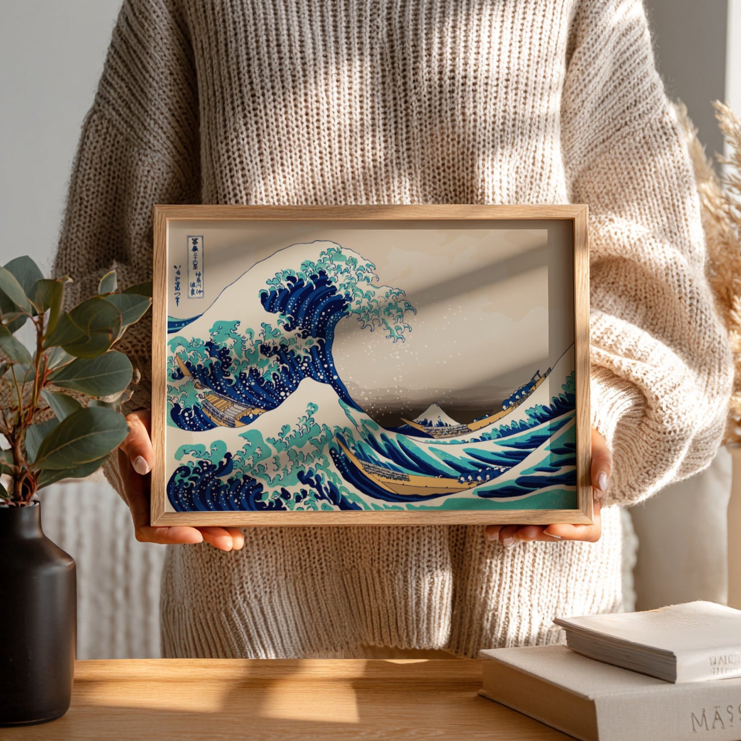 Famous art poster of Katsushika Hokusai's The Great Wave off Kanagawa, featuring ocean waves in blue and