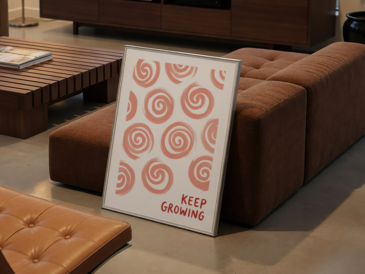 Motivational poster featuring hand-drawn peach spirals on white with Keep Growing red text.