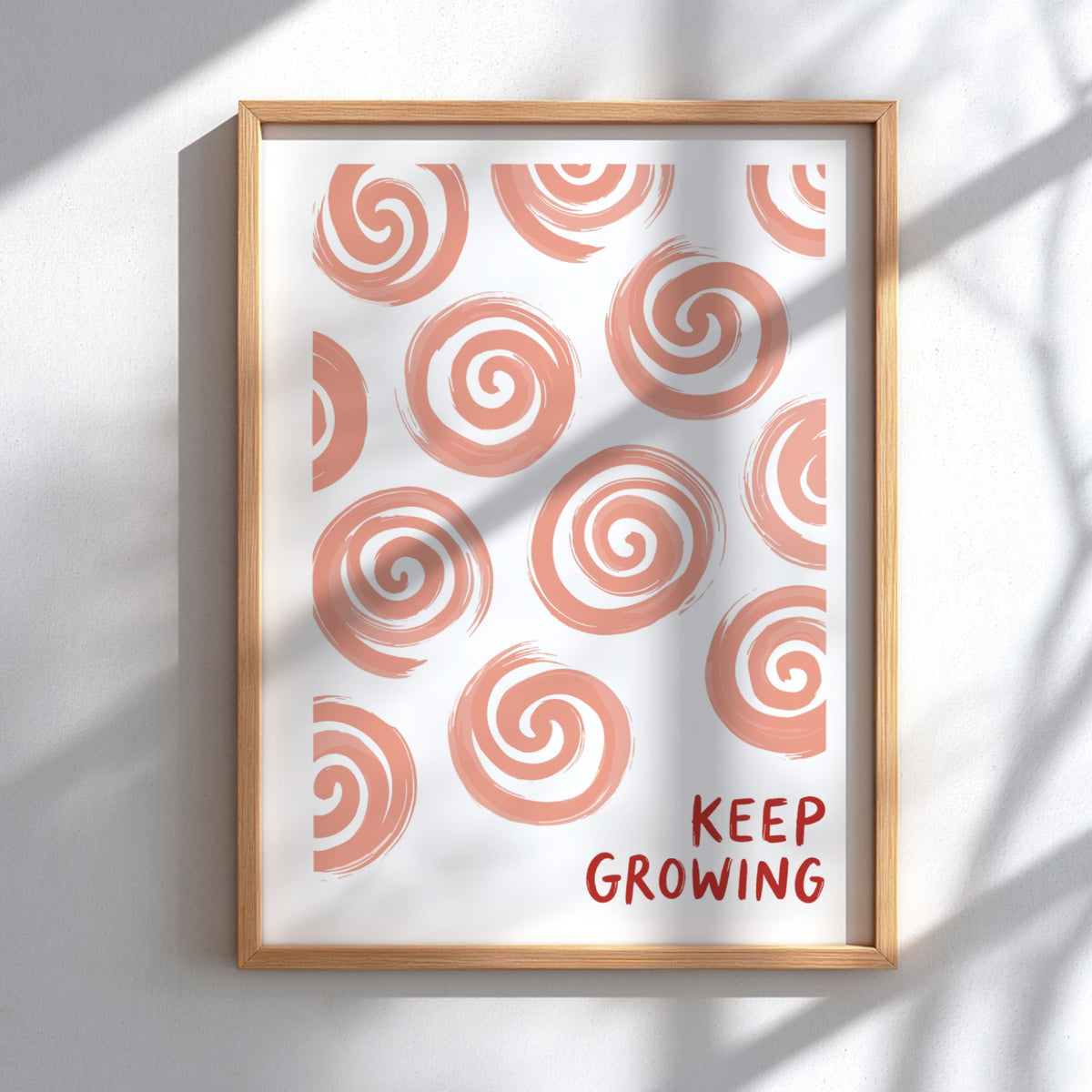 Motivational poster featuring hand-drawn peach spirals on white with Keep Growing red text.