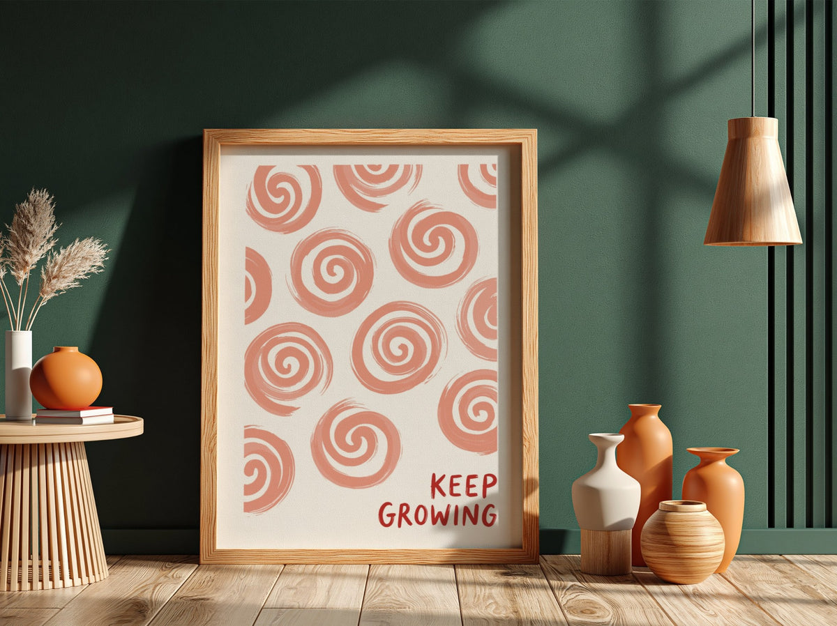 Motivational poster featuring hand-drawn peach spirals on white with Keep Growing red text.