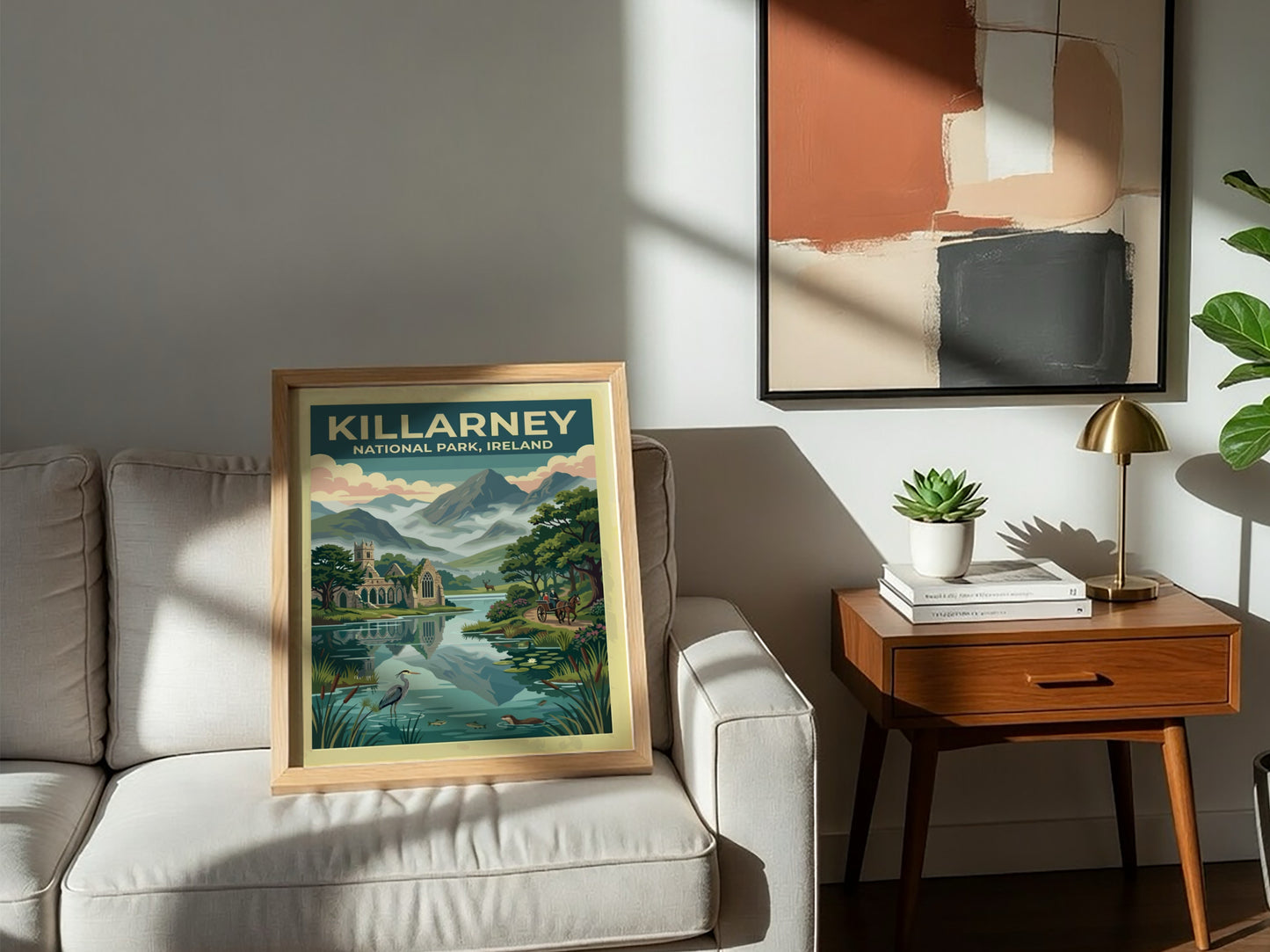 Travel poster of Killarney National Park featuring stone ruins mountains and a carriage