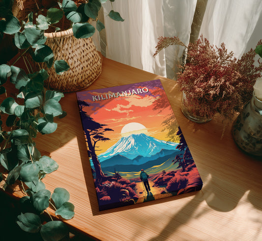 Book titled 'Kilimanjaro' on a wooden table with plants around