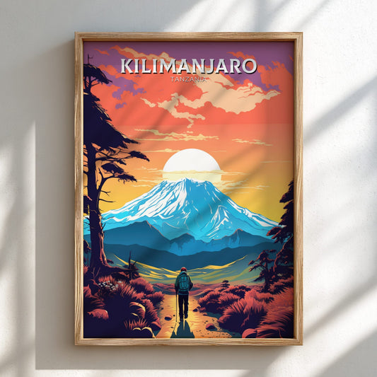Framed artwork of a mountain landscape with 'Kilimanjaro' text on a white wall.