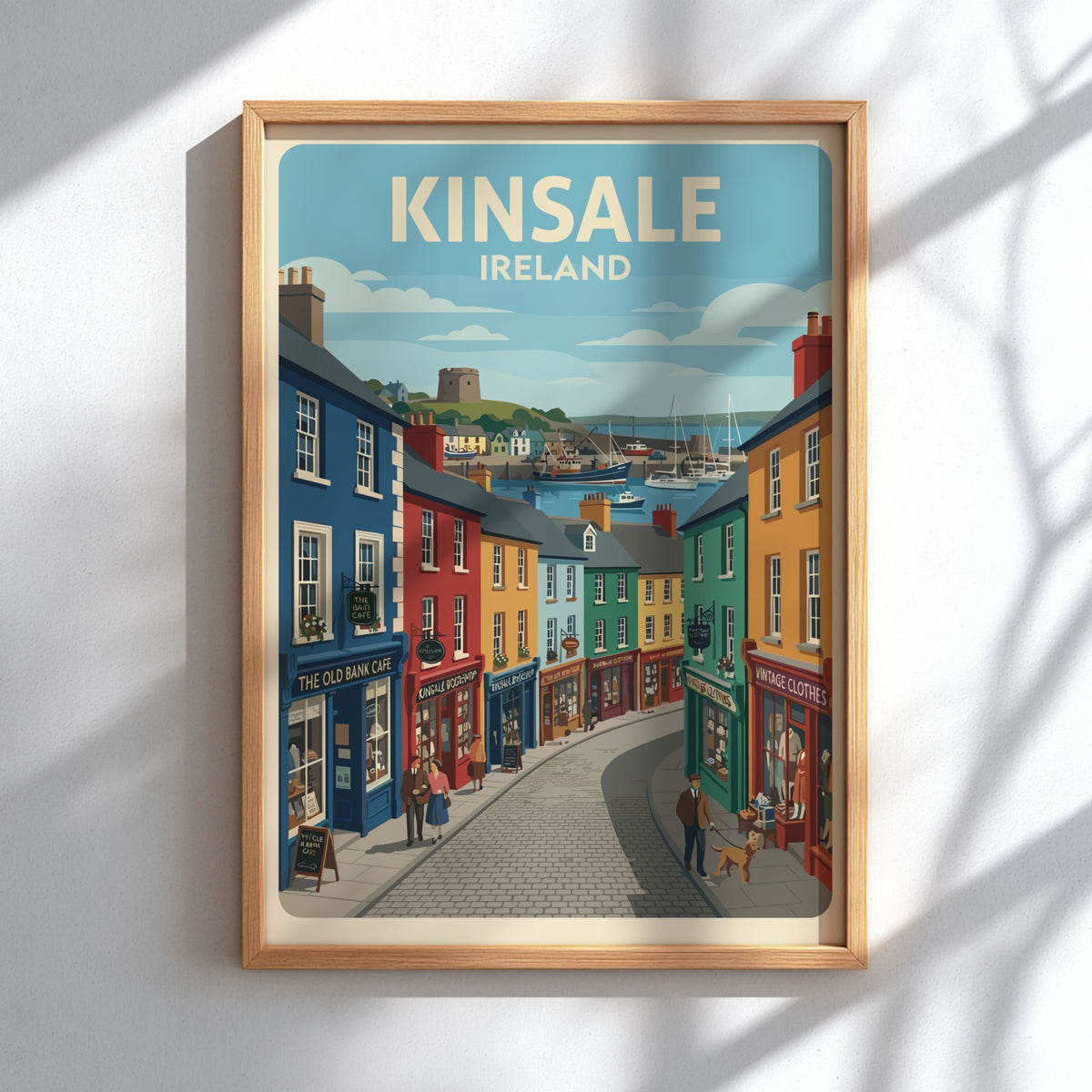 Poster of Kinsale Ireland featuring colourful storefronts and sailboats in a coastal harbour.