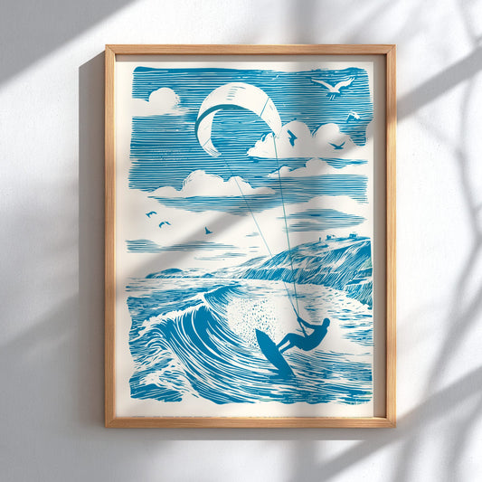 Framed artwork of a kite surfer on a wave with a blue sky and clouds.