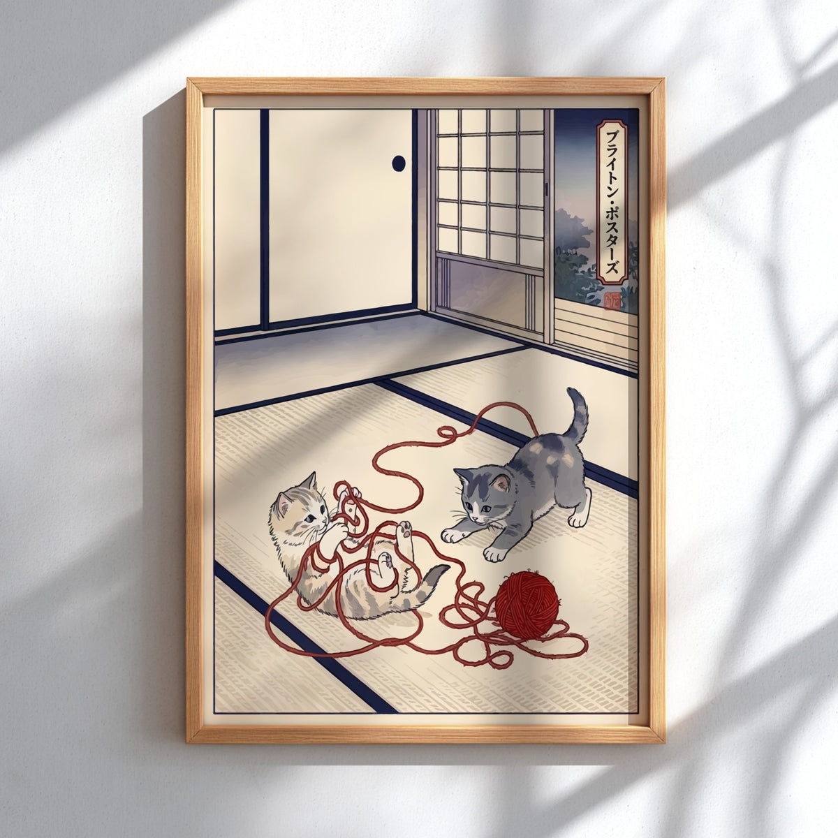 Poster featuring two kittens playing with red yarn in a traditional Japanese room style.