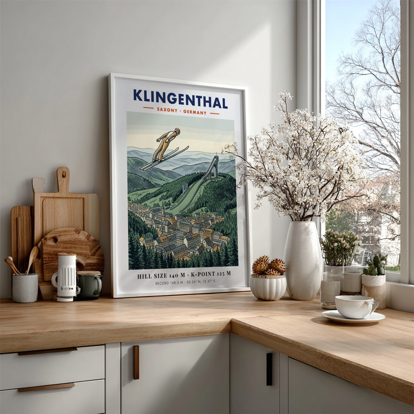 Poster of a ski jumper in flight over the Klingenthal town and hill.